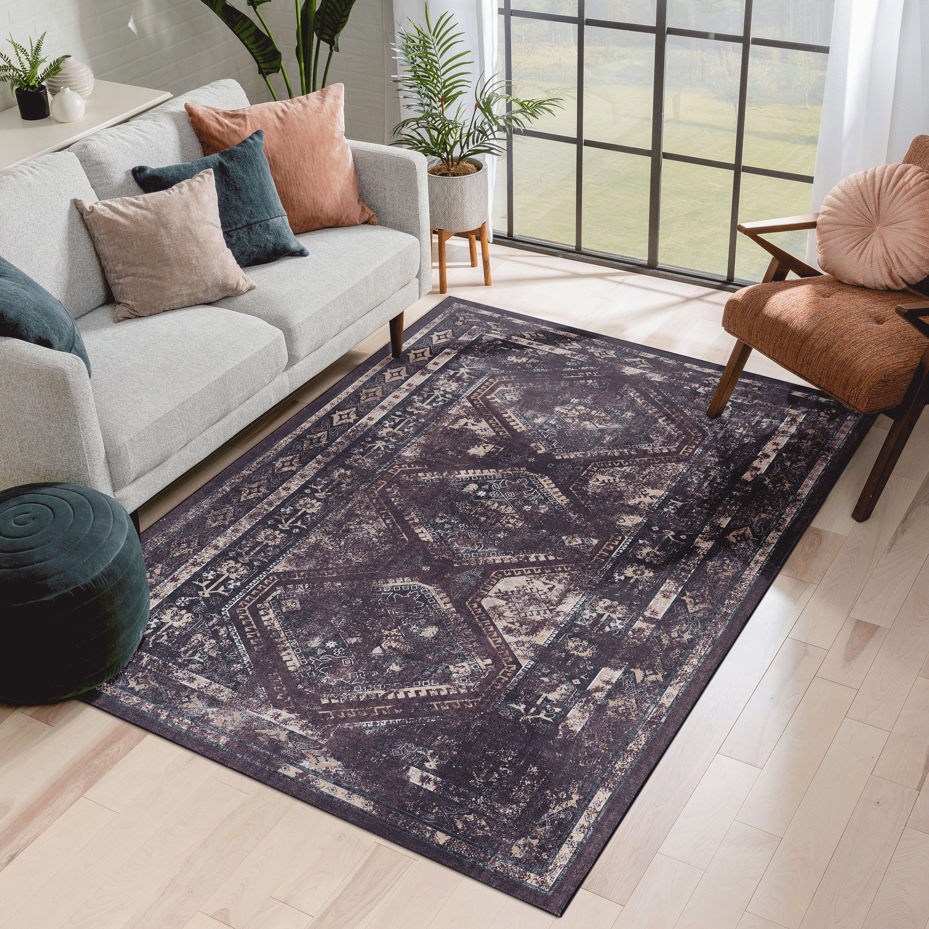 Black and burgundy washable area rug, 6 by 9 feet, in a living room